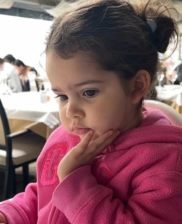 Aylin Mavi Yıldırım looking very cute in a pink hoody in a restaurant.  